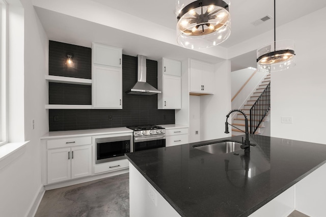 kitchen with open shelves, stainless steel gas range, visible vents, wall chimney range hood, and black microwave