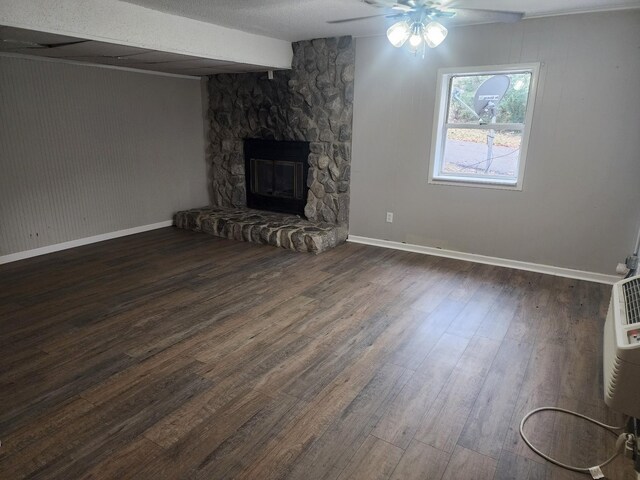 906 Edwards St, Madisonville, KY 42431 - unfurnished living room with a ceiling fan, a stone fireplace, baseboards, and wood finished floors