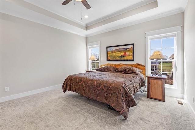 bedroom featuring ornamental molding, multiple windows, and carpet