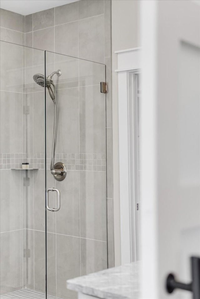 bathroom with a shower stall