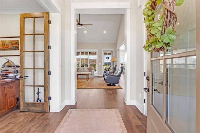 entryway with wood finished floors, french doors, a ceiling fan, and baseboards