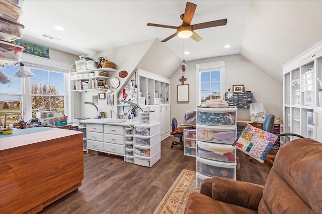 interior space with dark wood-style floors, a ceiling fan, lofted ceiling, and plenty of natural light