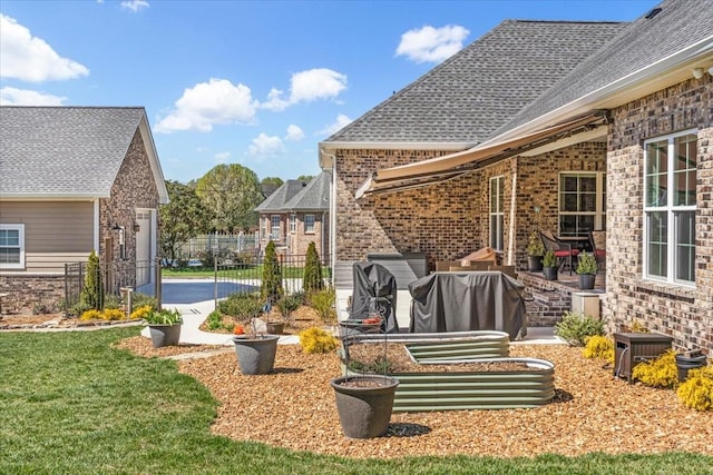 view of yard featuring a patio area and fence