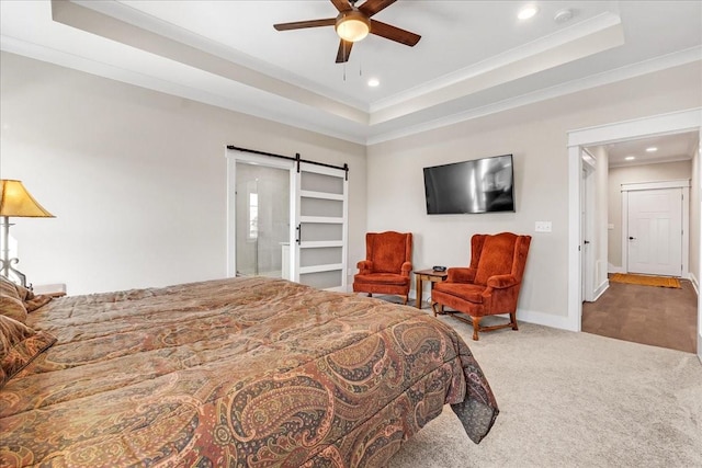 bedroom featuring recessed lighting, a barn door, a raised ceiling, crown molding, and carpet floors