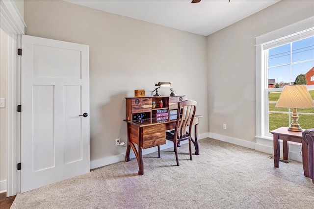 office space featuring ceiling fan, carpet flooring, and baseboards