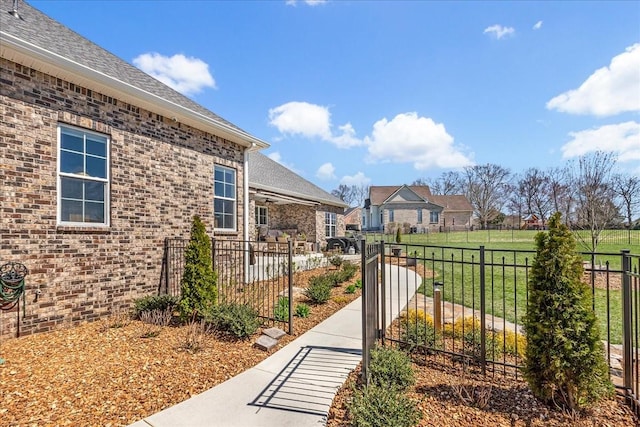 exterior space featuring a gate and fence private yard