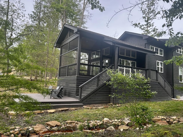 24 Acorn Cv, Tracy City, TN 37387 - rear view of house featuring stairs, a sunroom, and a wooden deck