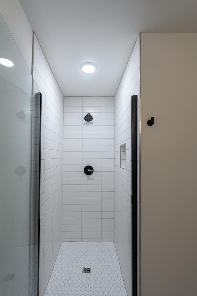 full bath featuring a shower stall