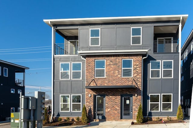 view of front of house with brick siding