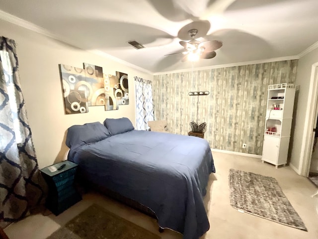 carpeted bedroom featuring crown molding, ceiling fan, and visible vents