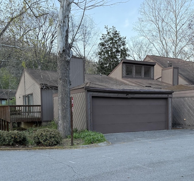 exterior space with roof with shingles