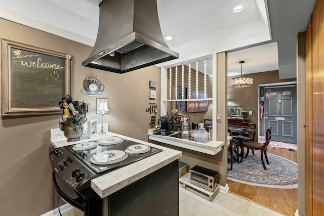 5025 Hillsboro Pike Unit 20E, Nashville, TN 37215 - kitchen featuring island exhaust hood, baseboards, wood finished floors, and recessed lighting