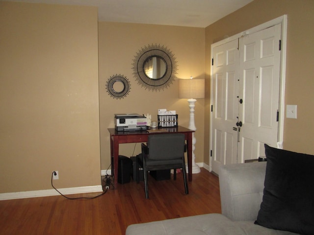 office featuring baseboards and wood finished floors
