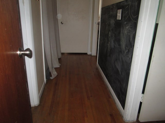 corridor featuring wood finished floors
