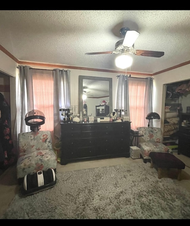 bedroom with crown molding, ceiling fan, and a textured ceiling