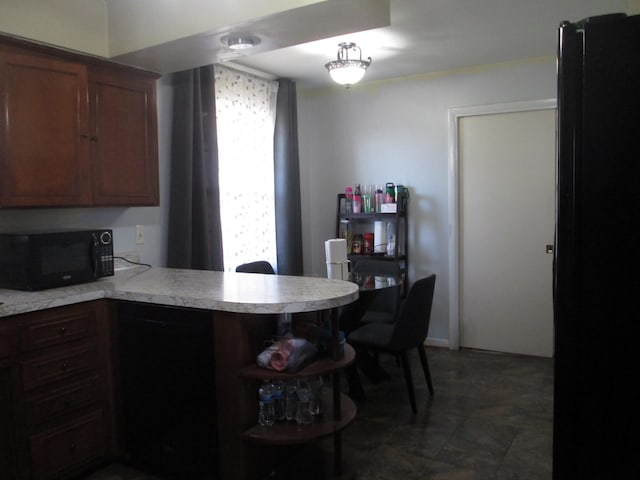 kitchen with light countertops, black appliances, open shelves, and a peninsula