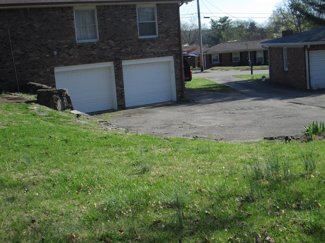 garage featuring driveway