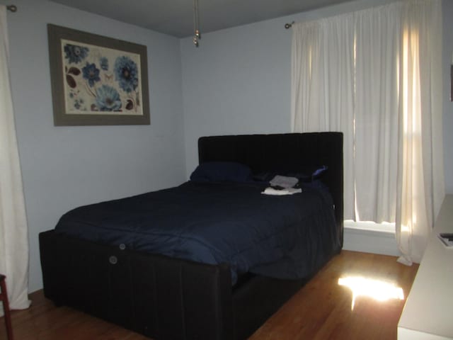 bedroom featuring wood finished floors
