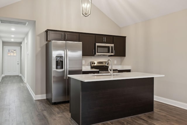 946 Tufnel Dr, Clarksville, TN 37040 - kitchen with light countertops, dark brown cabinetry, a sink, appliances with stainless steel finishes, and visible vents
