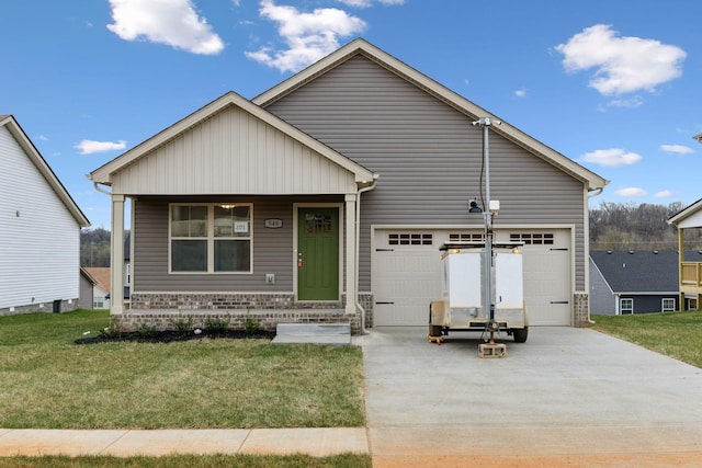 946 Tufnel Dr, Clarksville, TN 37040 - view of front of home with a front lawn, a garage, brick siding, and concrete driveway