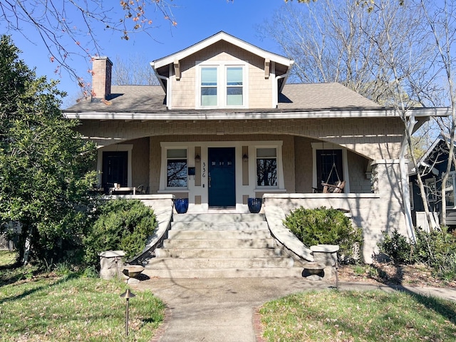 336 Chesterfield Ave, Nashville, TN 37212 - bungalow featuring a porch, a shingled roof, and a chimney