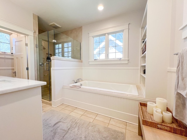 336 Chesterfield Ave, Nashville, TN 37212 - full bath featuring tile patterned flooring, a wainscoted wall, a healthy amount of sunlight, and a garden tub