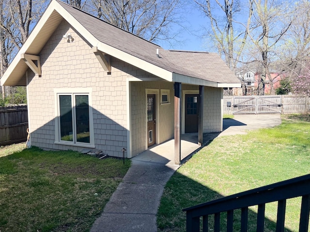 336 Chesterfield Ave, Nashville, TN 37212 - back of property with roof with shingles, fence, a gate, a yard, and a patio area
