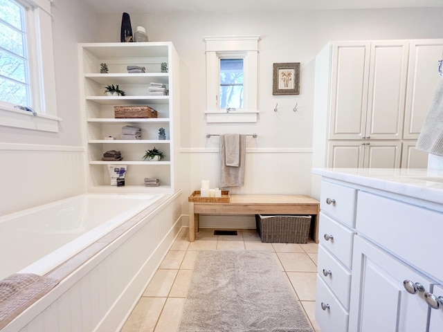 336 Chesterfield Ave, Nashville, TN 37212 - full bathroom featuring a wainscoted wall, tile patterned floors, and a bath