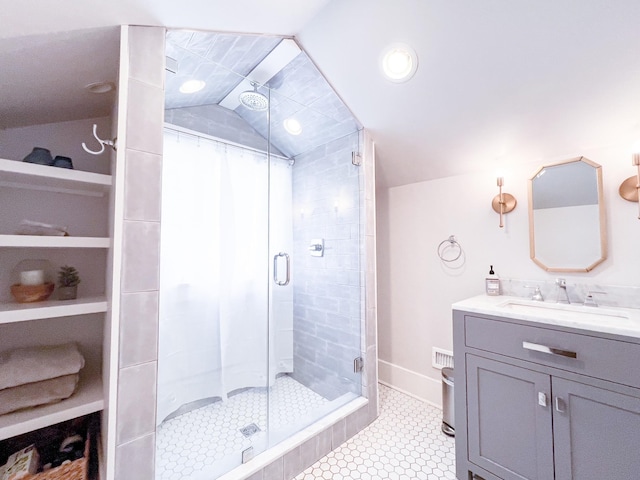 336 Chesterfield Ave, Nashville, TN 37212 - full bathroom featuring a stall shower, tile patterned floors, vaulted ceiling, vanity, and visible vents