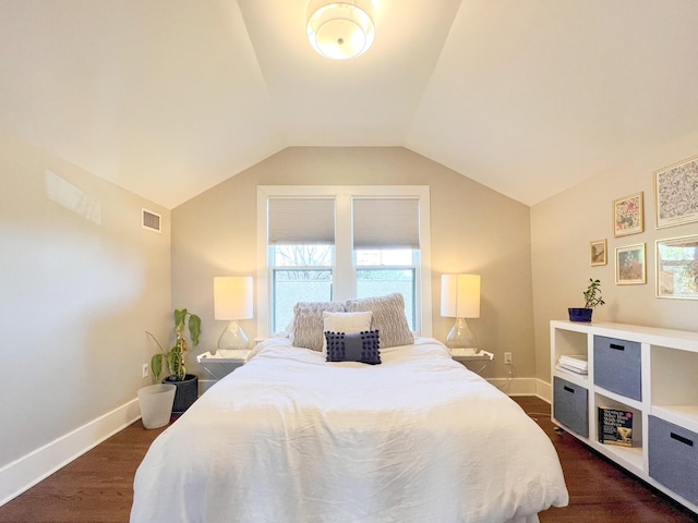 336 Chesterfield Ave, Nashville, TN 37212 - bedroom with baseboards, dark wood-style floors, lofted ceiling, and visible vents