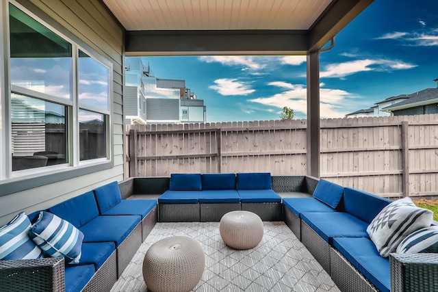 view of patio / terrace featuring an outdoor hangout area and fence