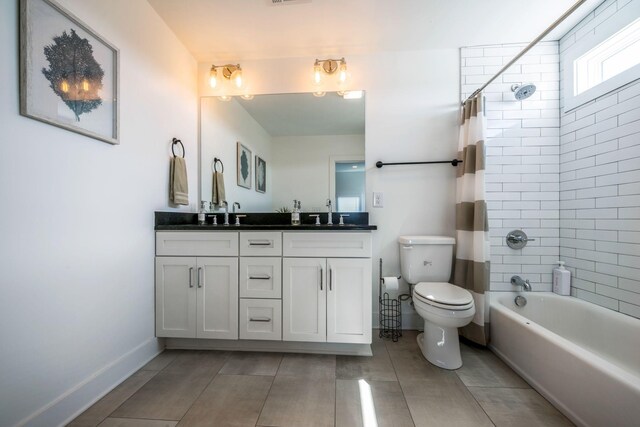 full bathroom with toilet, a sink, shower / tub combo, baseboards, and double vanity