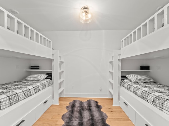 bedroom with wood finished floors