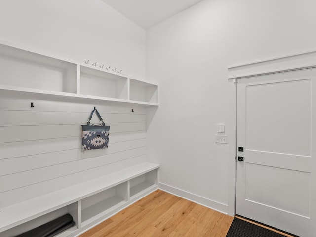 mudroom with light wood-style floors and baseboards