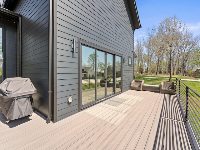 wooden deck featuring grilling area