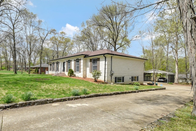 view of front facade featuring a carport, a front lawn, brick siding, and concrete driveway