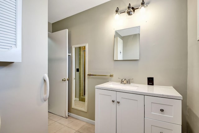 bathroom featuring tile patterned floors and vanity
