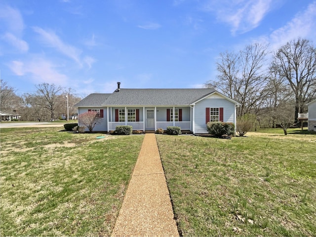 ranch-style home with a front yard, a porch, and roof with shingles