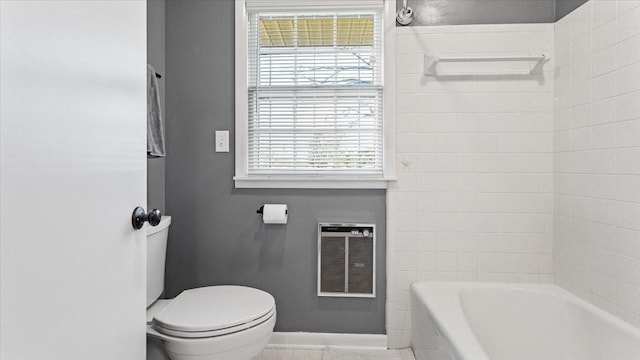 full bathroom with heating unit, baseboards, and toilet