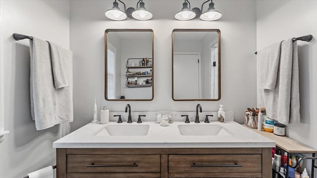 bathroom featuring double vanity and a sink