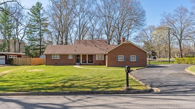 single story home with driveway, a chimney, fence, a front lawn, and crawl space