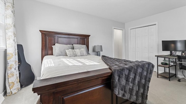 bedroom with a closet and light carpet
