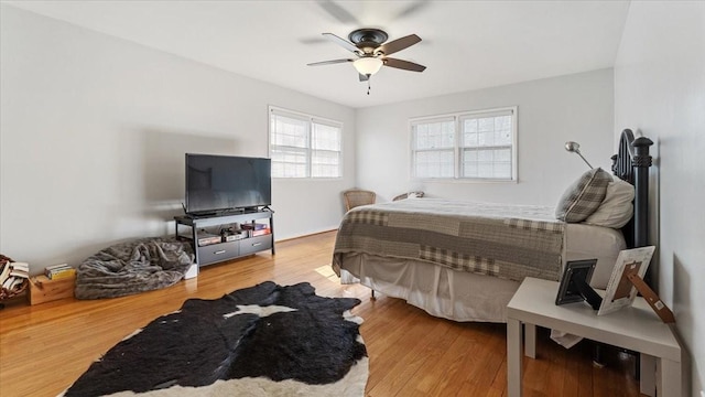 bedroom featuring wood finished floors and ceiling fan