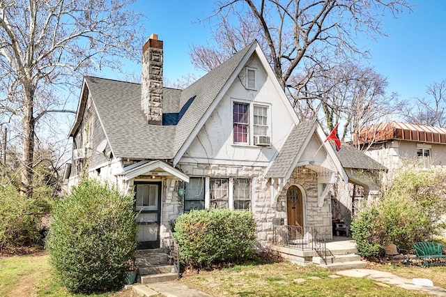 3524 W End Ave, Nashville, TN 37205 - tudor-style house featuring cooling unit, a chimney, a shingled roof, and stone siding