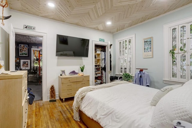 3524 W End Ave, Nashville, TN 37205 - bedroom with a closet, light wood-style flooring, ornamental molding, recessed lighting, and a spacious closet
