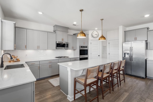 576 Nottingham Ave, Hendersonville, TN 37075 - kitchen with gray cabinets, a sink, a kitchen island, stainless steel appliances, and visible vents