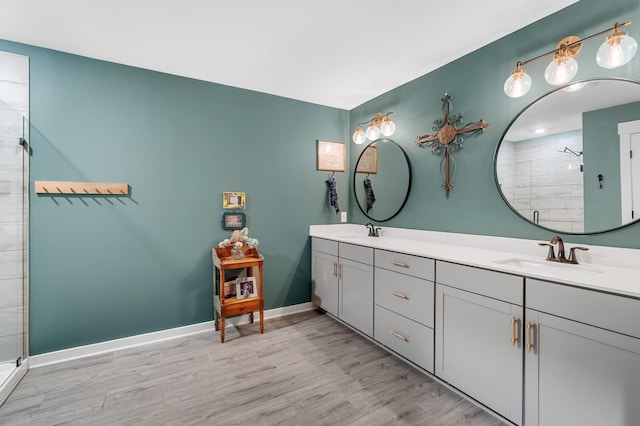 576 Nottingham Ave, Hendersonville, TN 37075 - full bath with baseboards, a sink, tiled shower, and wood finished floors