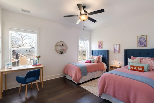bedroom featuring dark wood-style floors, baseboards, and a ceiling fan