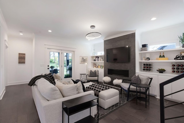 living area featuring dark wood-style floors, a fireplace, recessed lighting, and baseboards
