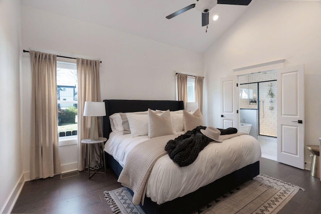 bedroom with dark wood-style flooring, high vaulted ceiling, ensuite bath, ceiling fan, and baseboards